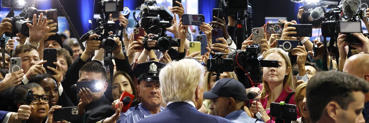 Former U.S. President Donald Trump speaks to reporters