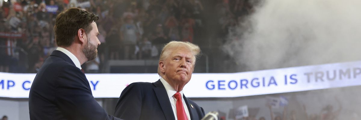 Former U.S. President Donald Trump takes the stage with U.S. Sen. JD Vance