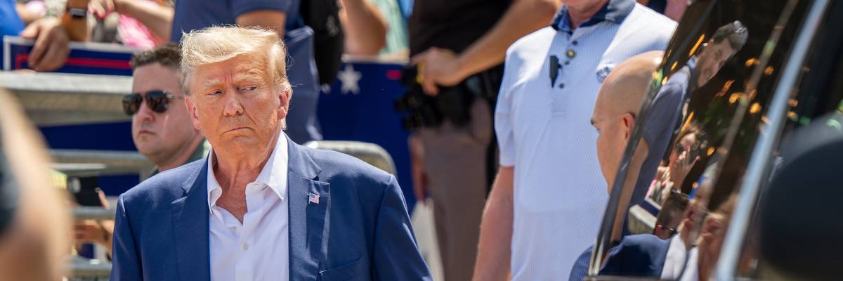 Former U.S. President Donald Trump walks to his vehicle