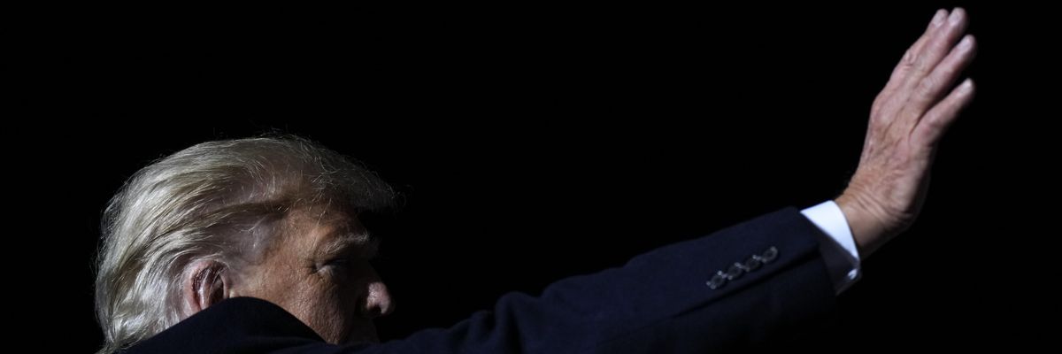 Former U.S. President Donald Trump waves at the end of a rally on November 7, 2022 in Vandalia, Ohio.