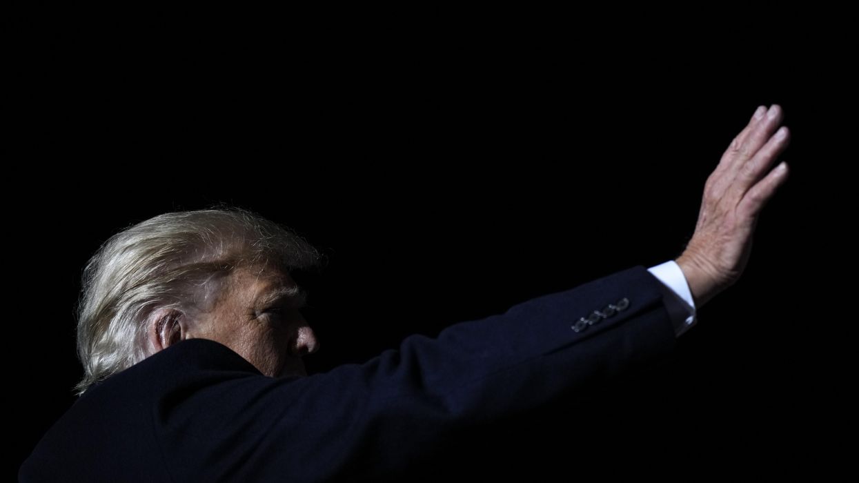 Former U.S. President Donald Trump waves at the end of a rally on November 7, 2022 in Vandalia, Ohio.