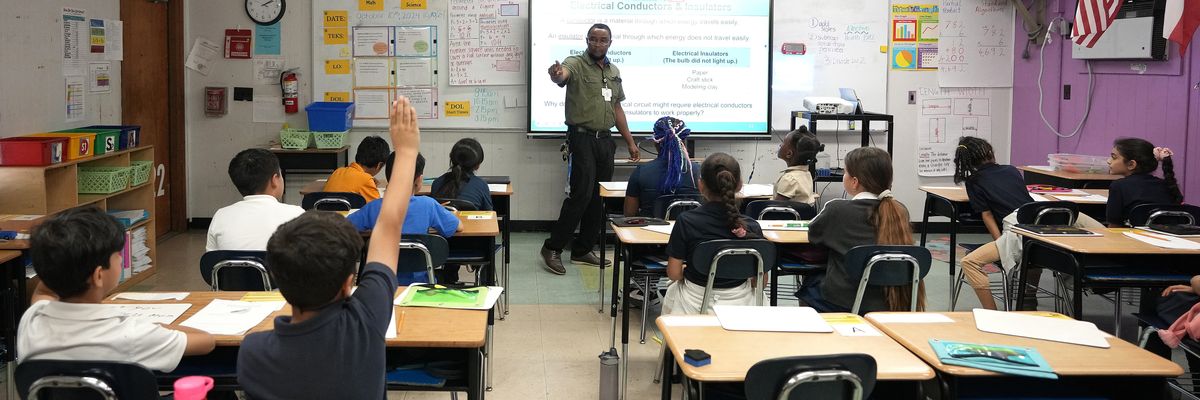 Fourth grade science teacher Paul Obakpolo teaches at Benavidez Elementary School