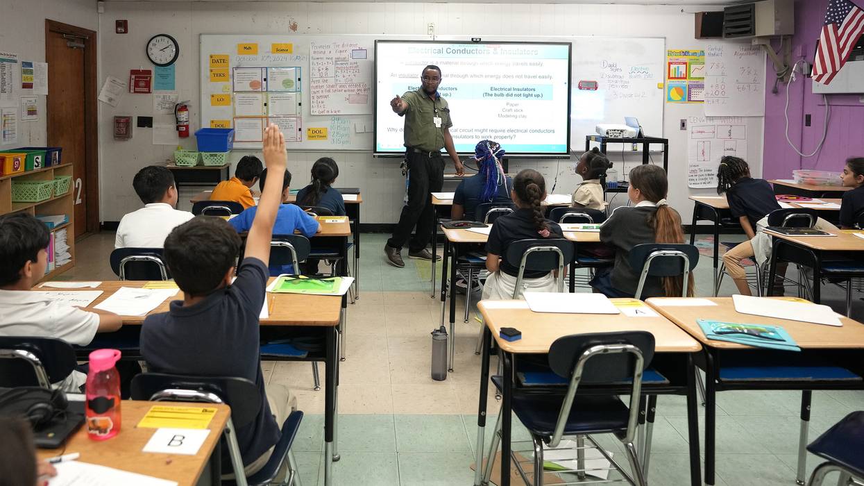 Fourth grade science teacher Paul Obakpolo teaches at Benavidez Elementary School