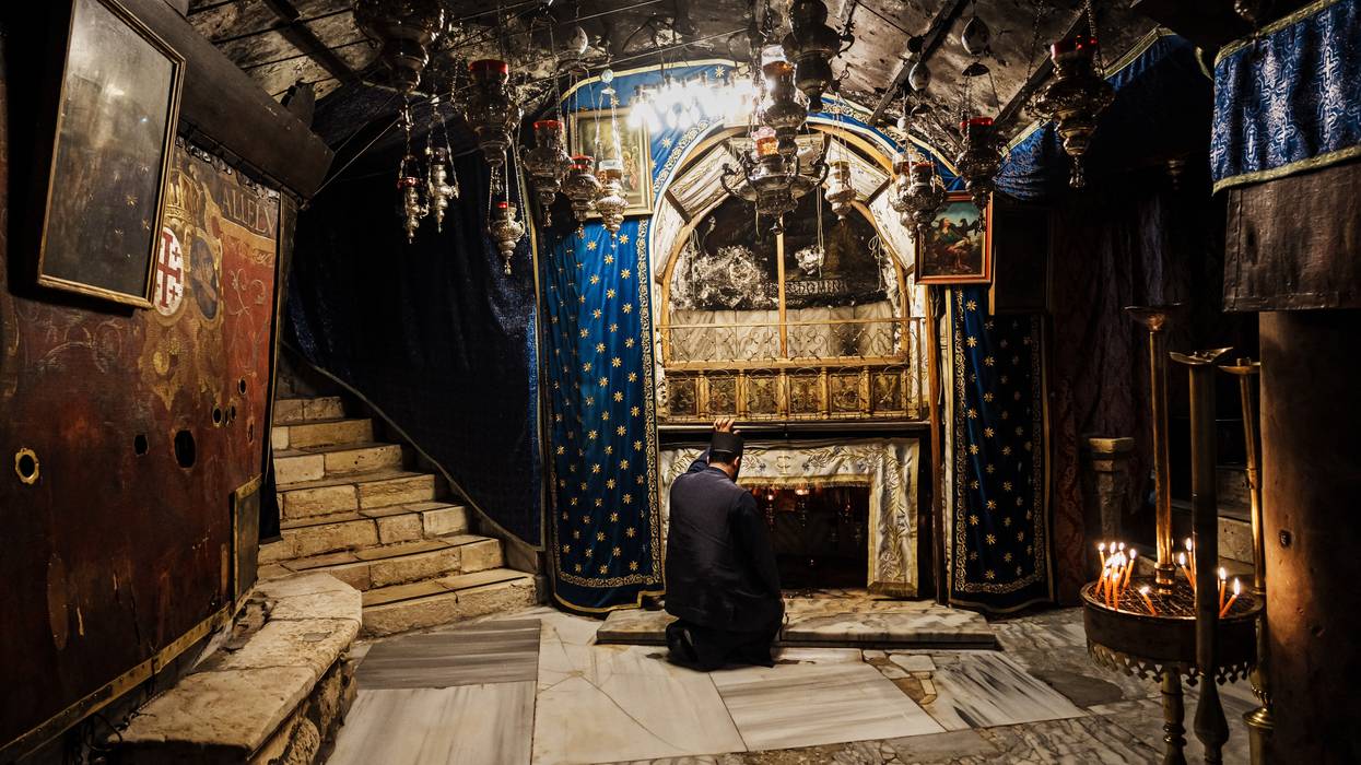 Fr. Issa Thaljieh poses in the Grotto of the Nativity in Bethlehem, Occupied West Bank.