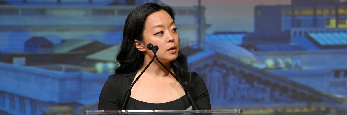 Francesca Hong speaks into a microphone.