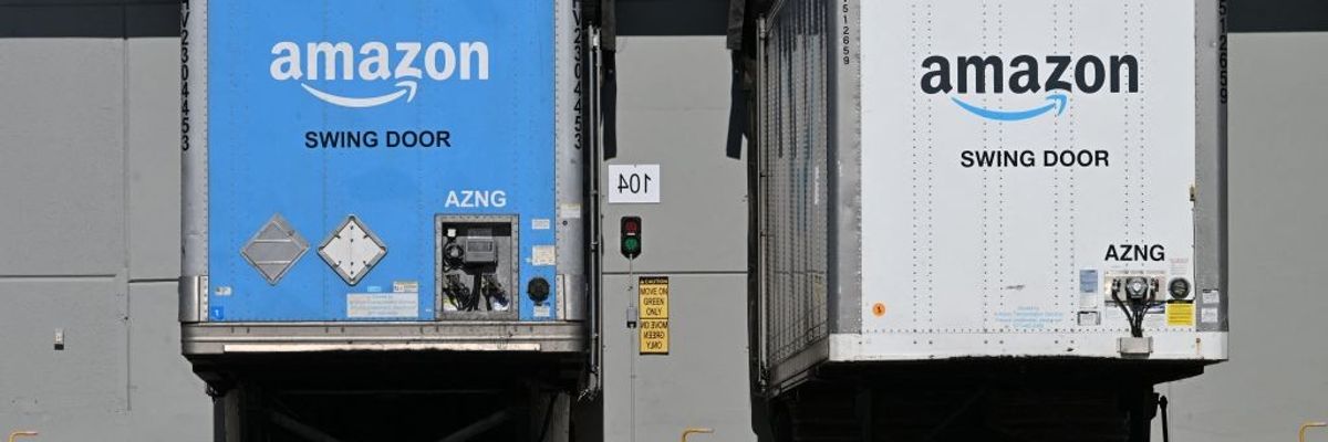 Freight semi-trailers are docked at the Amazon warehouse