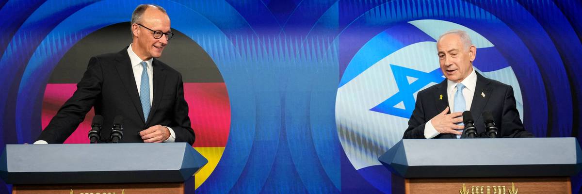 Friedrich Merz and Benjamin Netanyahu stand at podiums during a joint press conference