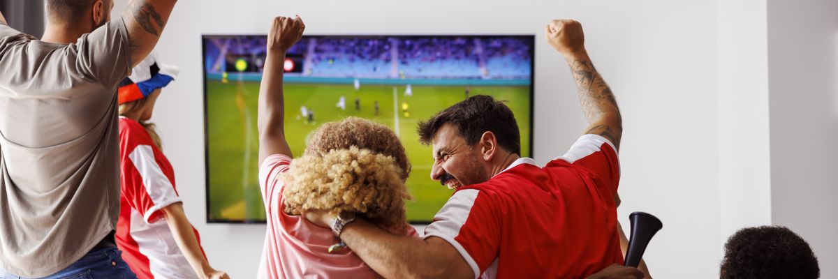 Friends watching sports on TV.