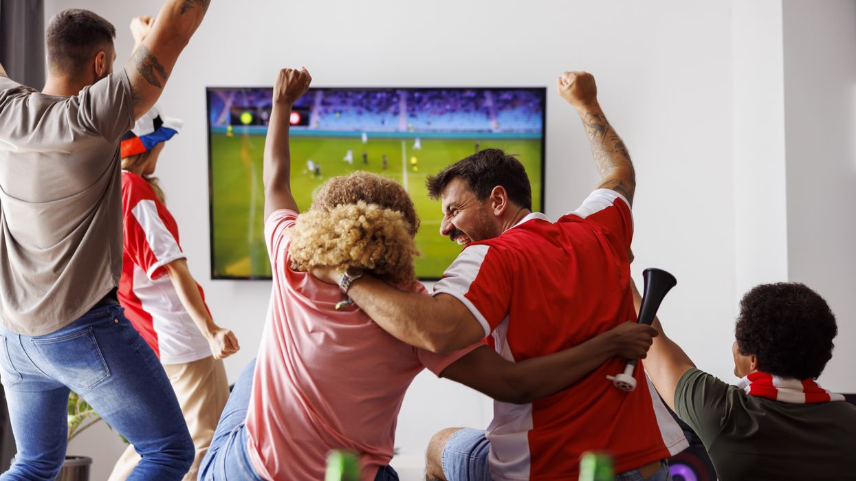 Friends watching sports on TV.