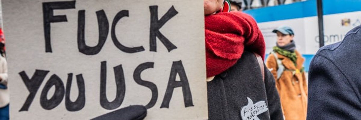 "Fuck You, USA" sign says