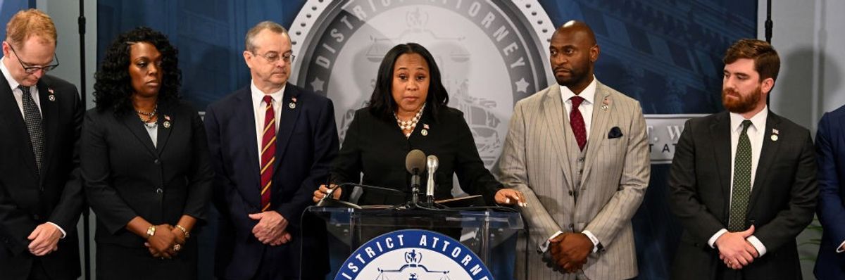 Fulton County District Attorney Fani Willis speaks during a news conference.