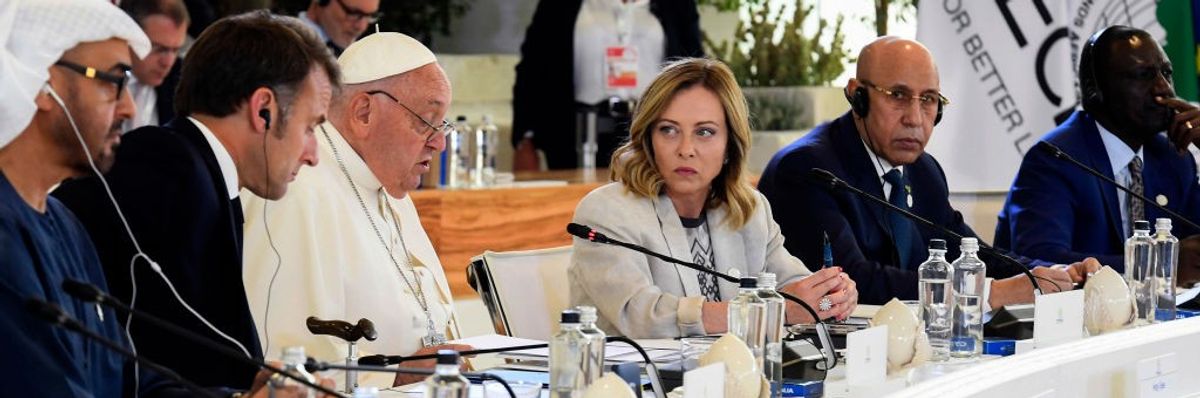 G7 leaders and the Pope sit at a table