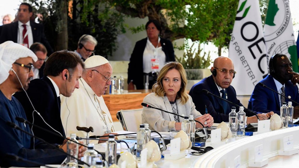 G7 leaders and the Pope sit at a table