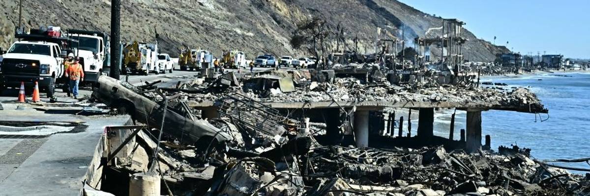 Gas company employees work in Malibu, California, after the Palisades Fire