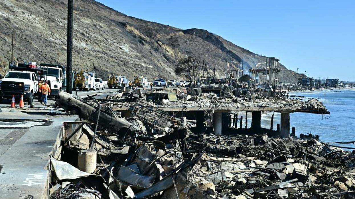 Gas company employees work in Malibu, California, after the Palisades Fire