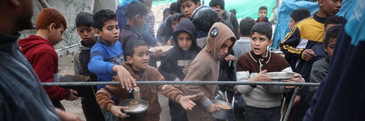 Gaza children queue for food
