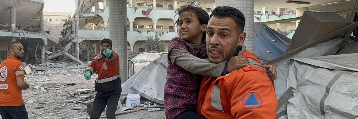 Gaza first responders rescue a girl from a bombed school