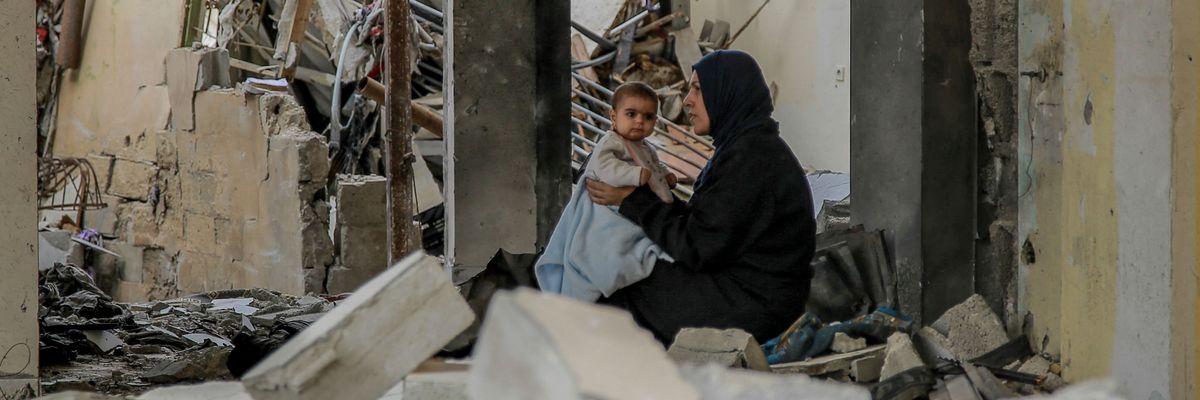 Gaza woman holds baby