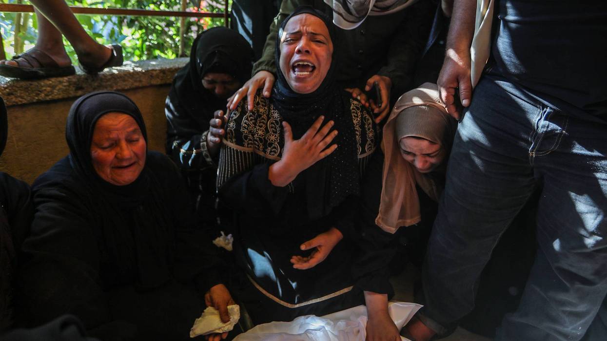 Gaza women mourn a Palestinian child killed by Israel