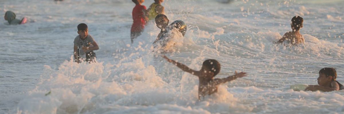 Gazan children swim in the Mediterranean Sea