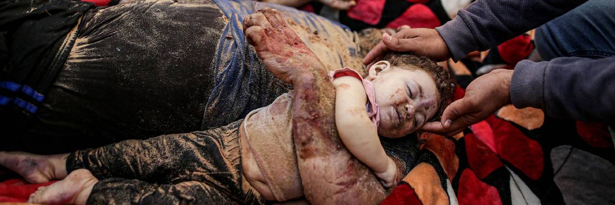 Gazan father Muhammed Gouda and his baby daughter Misk lay dead at Aqsa Hospital