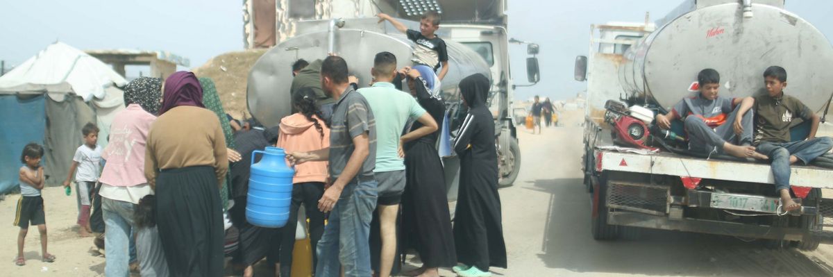 Gazans queue up for water amid a heatwave