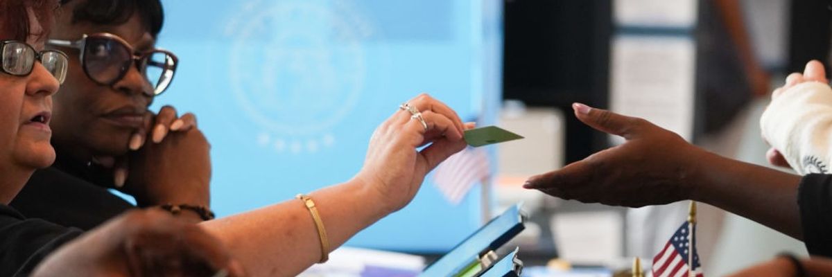 Georgians Head To The Polls On Last Day Of Early Voting Ahead Of Tuesday's Election