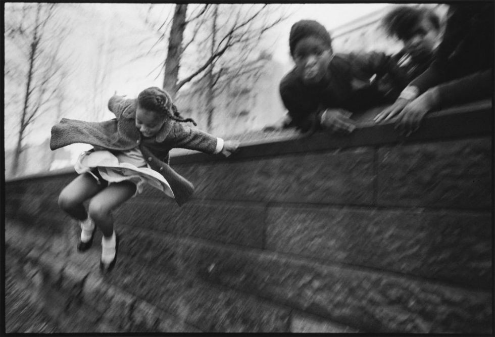 Girl jumping over a wall, Central Park, New York, 1967