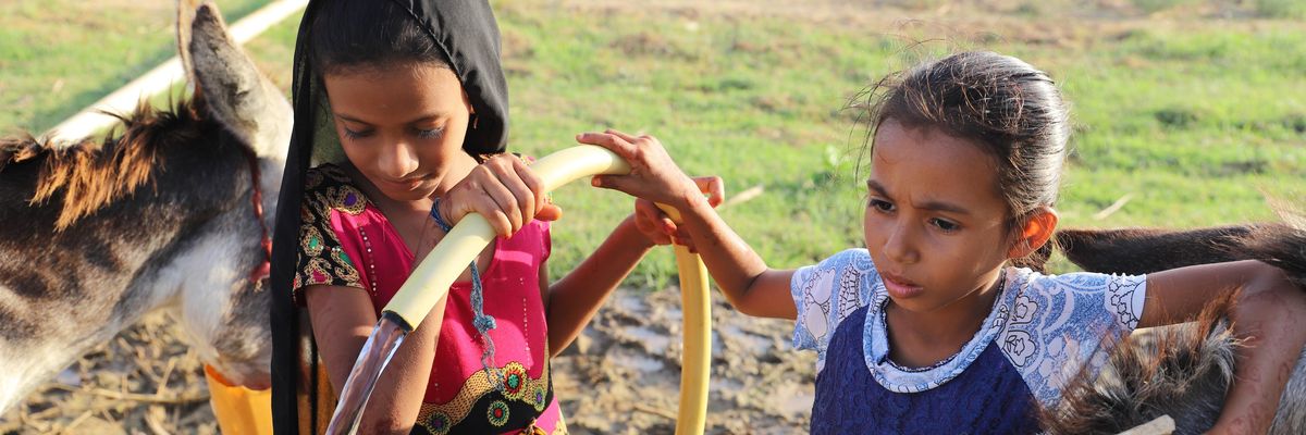 Girls collect water from a well in Hajjah province, north Yemen on December 11, 2020.