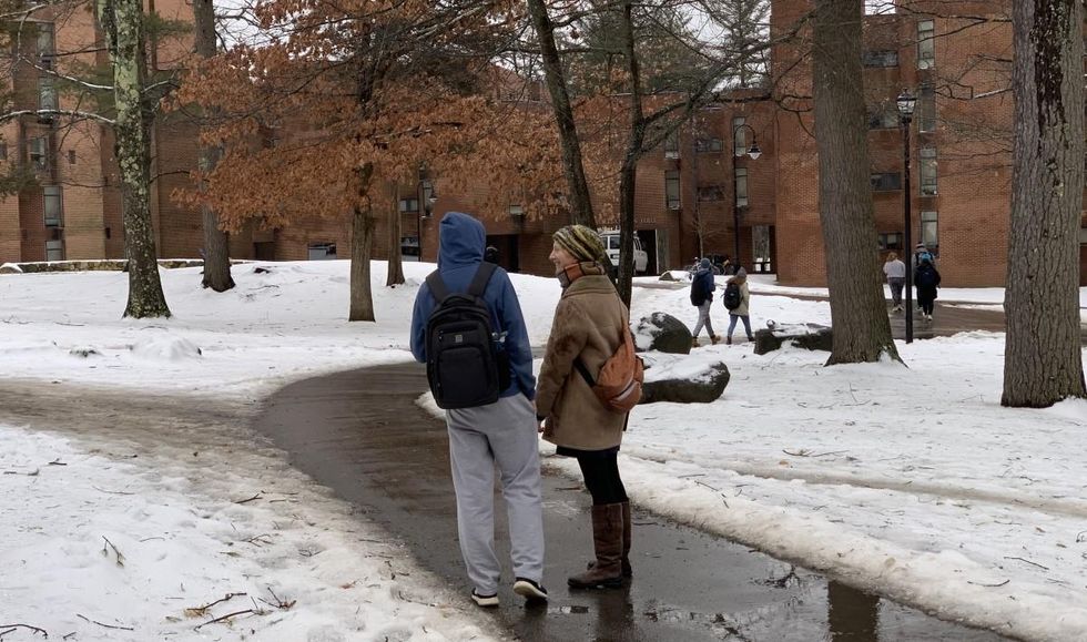 Giselle Hart of Rights and Democracy New Hampshire talks to a prospective student voter on UNH campus in Durham, New Hampshire.