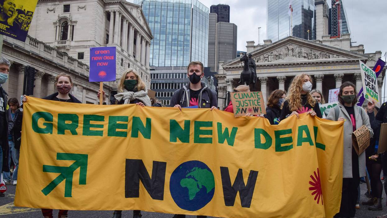 Global Green New Deal sign at COP26