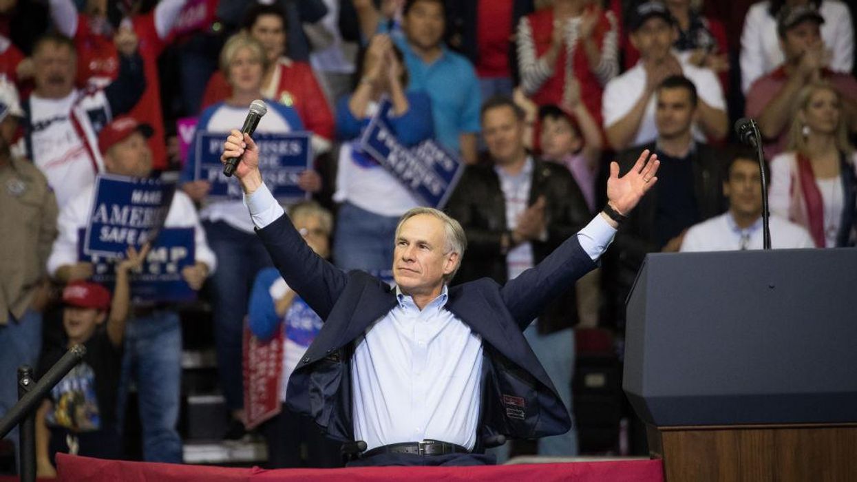 Governor Greg Abbott of Texas with arms raised