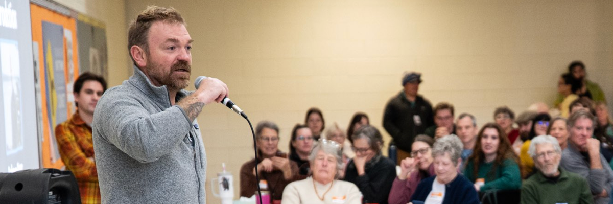 Graham Platner addresses a crowd of Maine voters