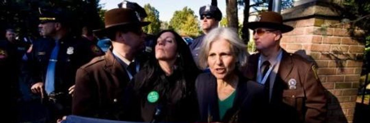 Green Party Presidential candidate Jill Stein (pictured right) and Vice-Presidential candidate Cheri Honkala are stopped and arrested for attempting to gain access to the campus of Hofstra University, site of the second of three presidential debates between Mitt Romney and Barack Obama. (Photo: Alamy)