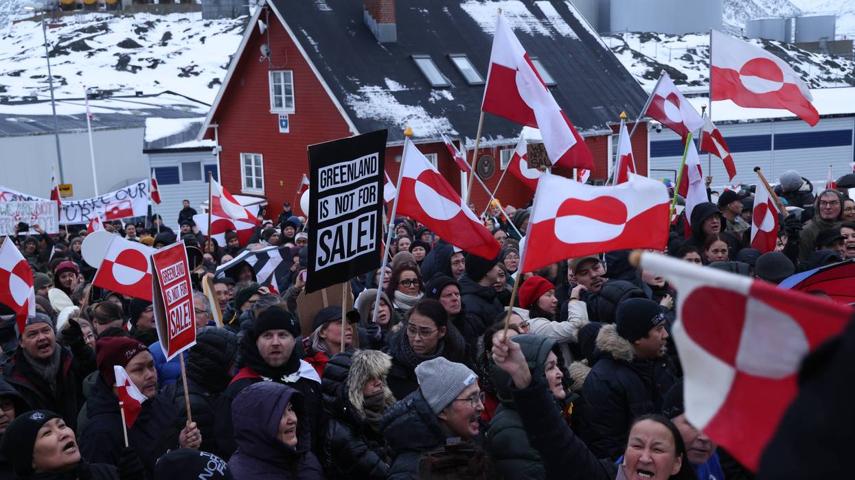 Greenlanders protest Trump with flags and signs reading "Greenland is not for sale"