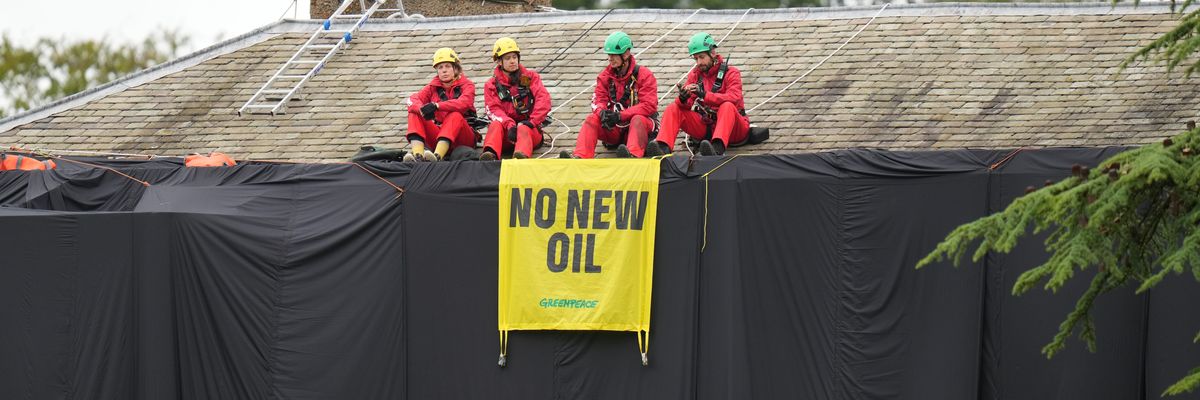 Greenpeace activists are pictured on the roof of U.K. Prime Minister Rishi Sunak's mansion