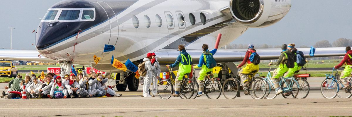 Greenpeace activists block private jet in Amsterdam
