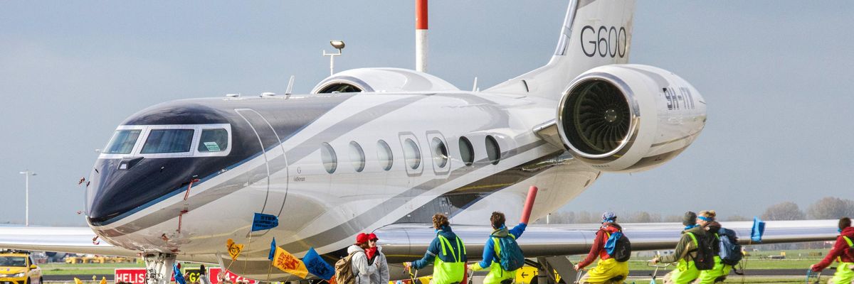 Greenpeace activists block private jet in Amsterdam