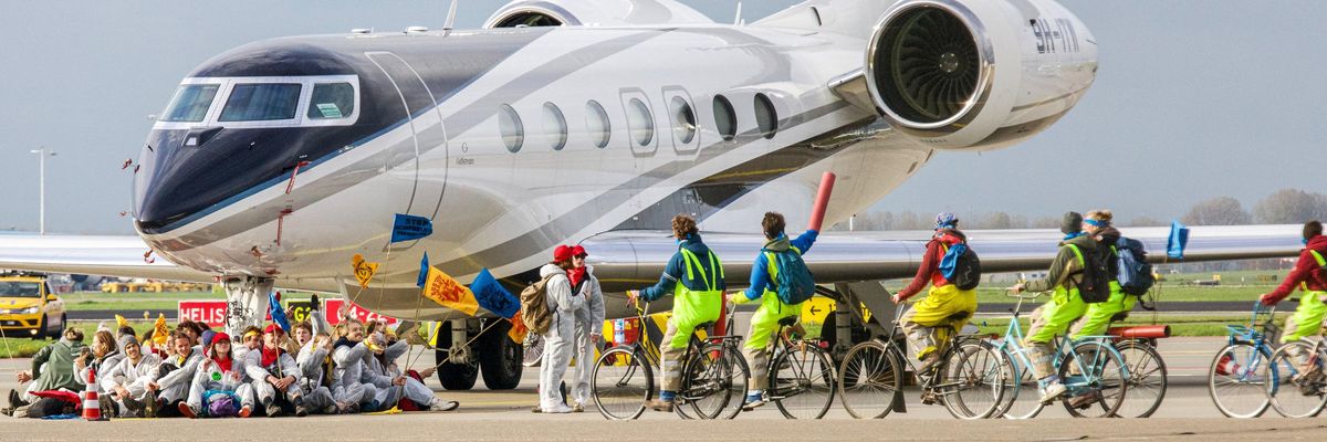 Greenpeace activists block private jet in Amsterdam