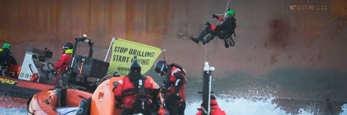 Greenpeace activists board a Shell platform