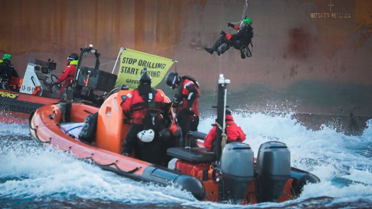 Greenpeace activists board a Shell platform