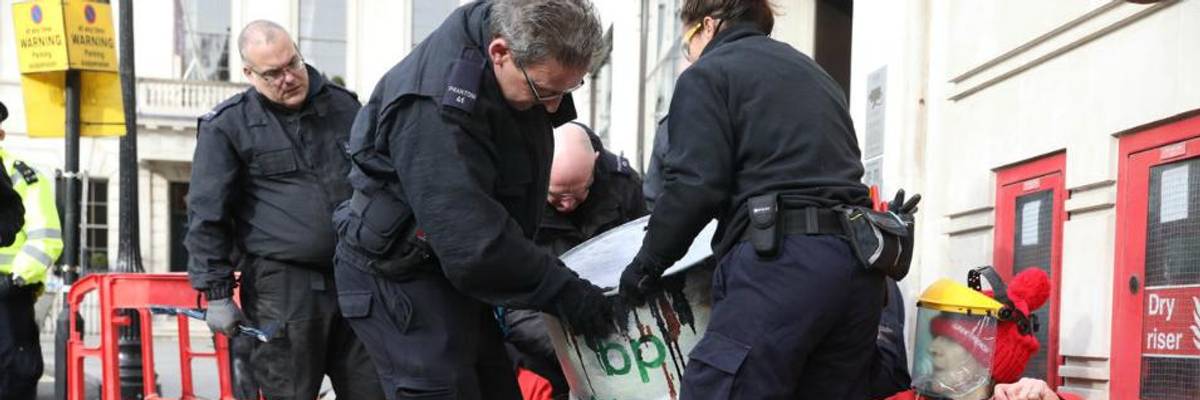 Greenpeace Greets New BP CEO by Shutting Down London Headquarters With Oil Barrels and 500 Solar Panels