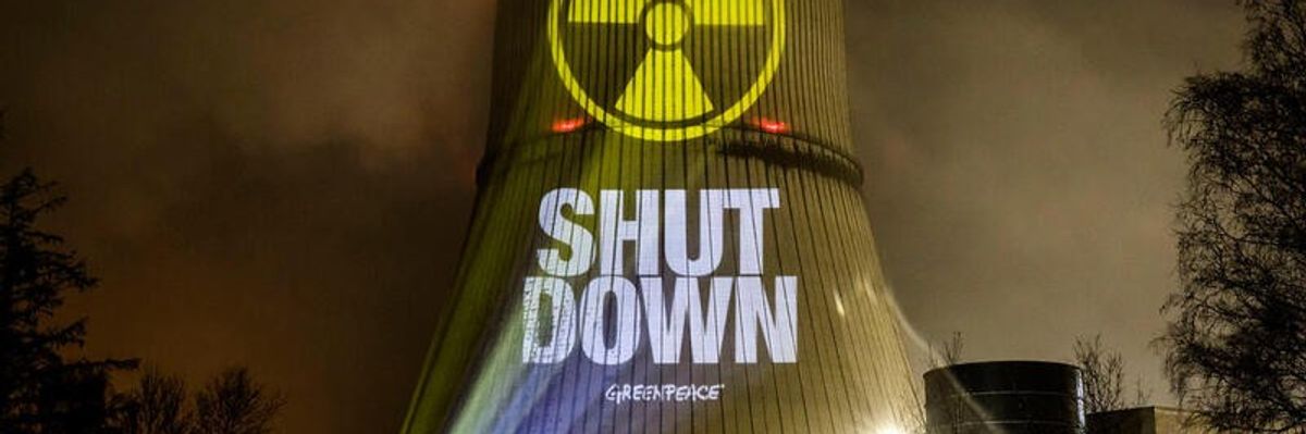 Greenpeace activists protest against nuclear power at Germany's three remaining nuclear power plants using projectors on March 9, 2023.