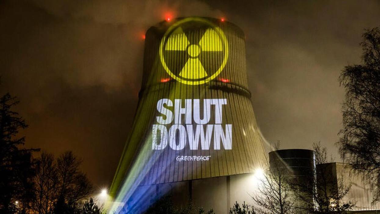 Greenpeace activists protest against nuclear power at Germany's three remaining nuclear power plants using projectors on March 9, 2023.