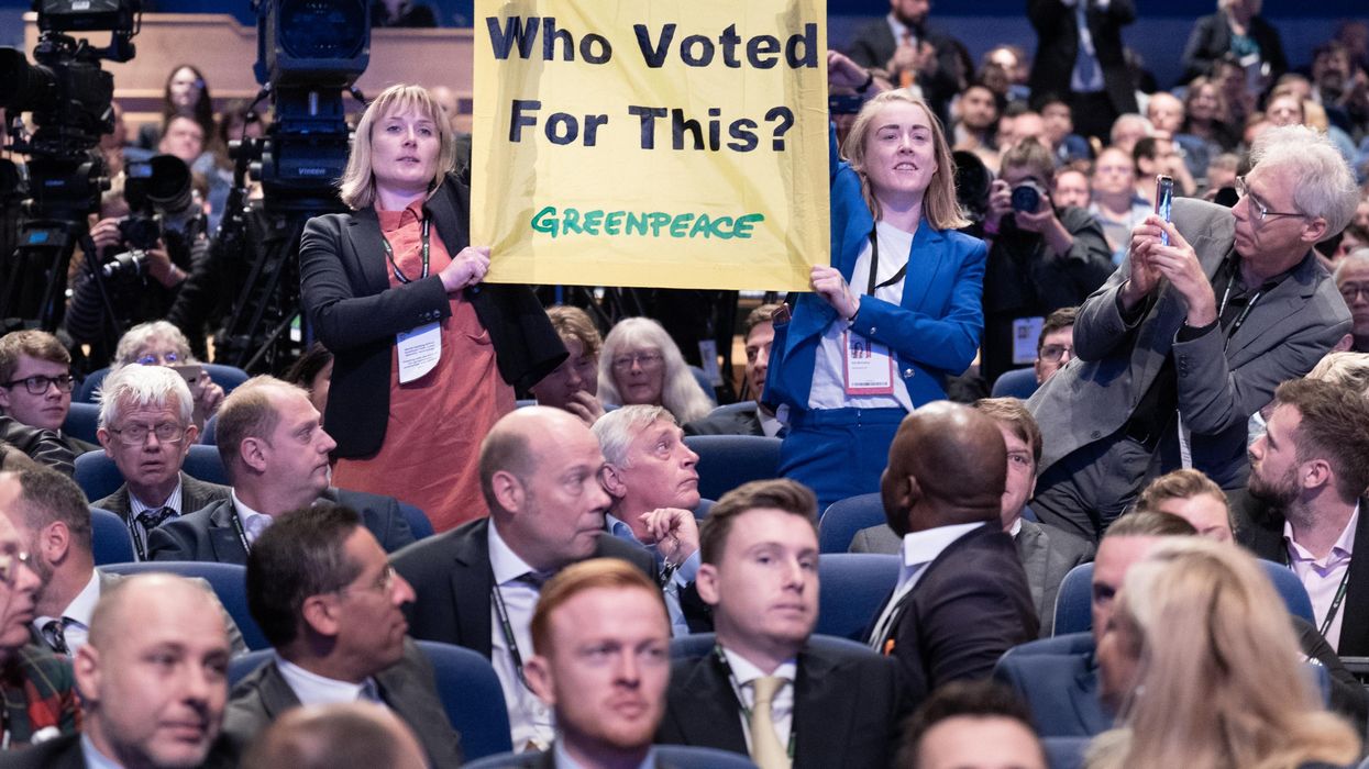 Greenpeace activists protesting Liz Truss