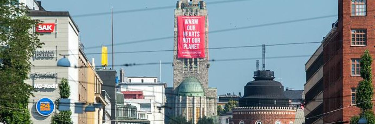 'Warm Our Hearts Not Our Planet': Greenpeace Demands Climate Action From Trump and Putin