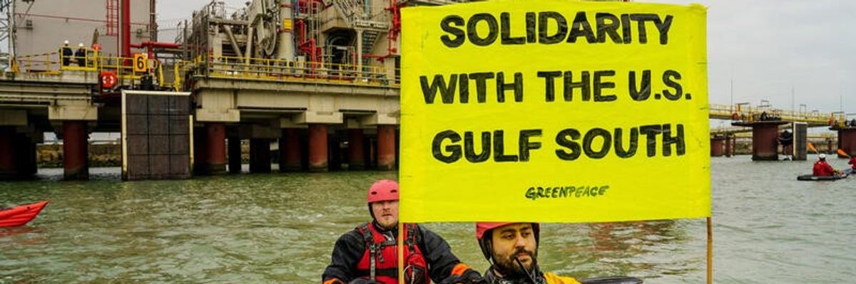 Greenpeace activists with sign: "Solidarity With the US Gulf South"