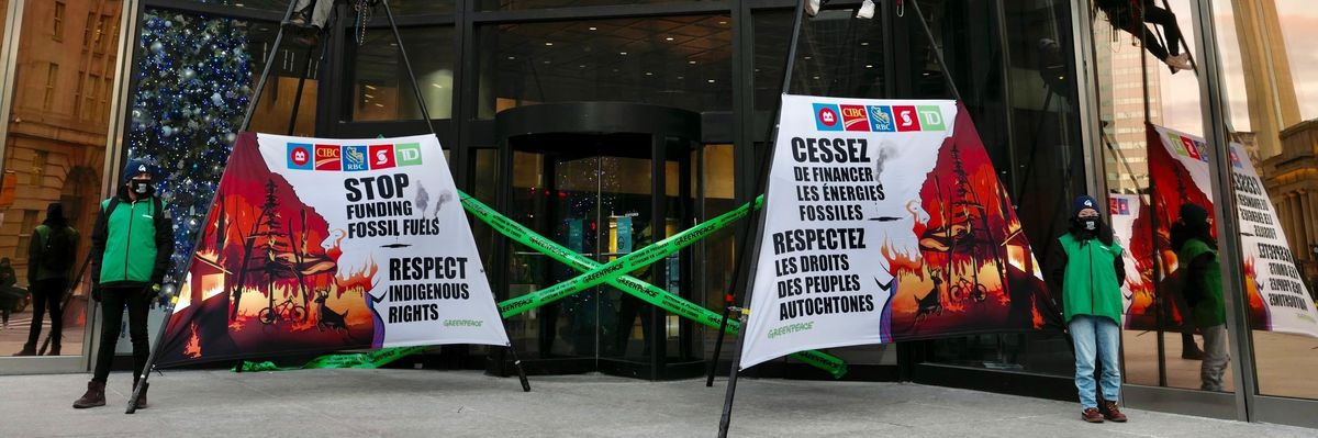 Greenpeace Canada campaigners disrupt business as usual in Toronto's financial district on December 7, 2021