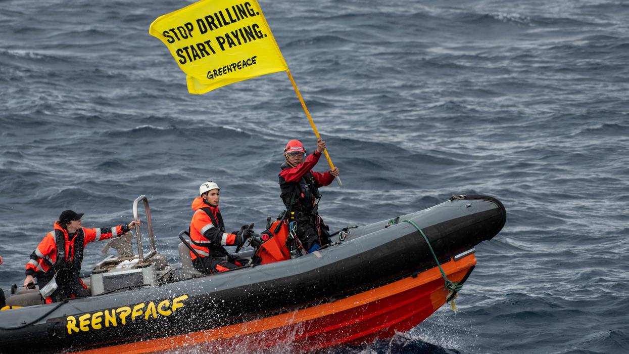 Greenpeace climate justice activists approaching a Shell platform by boat