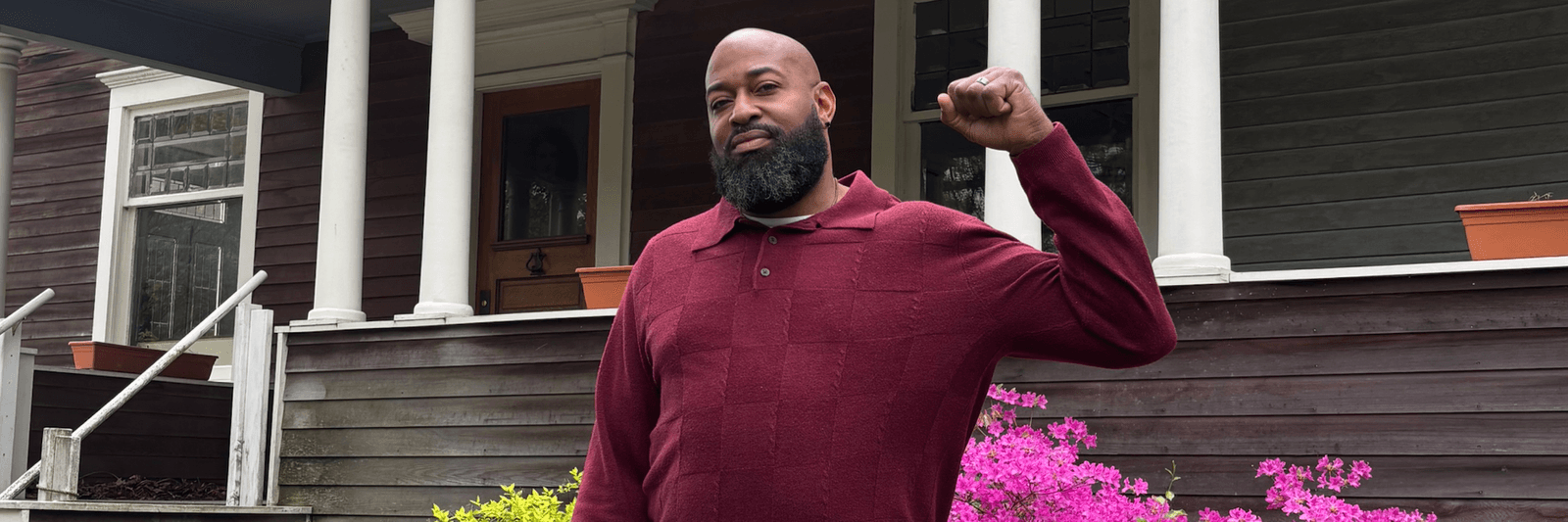 greg-levy-stands-outside-john-brown-s-house-with-his-fist-raised.png?id=68425169&width=1200&height=400&coordinates=0%2C211%2C0%2C458